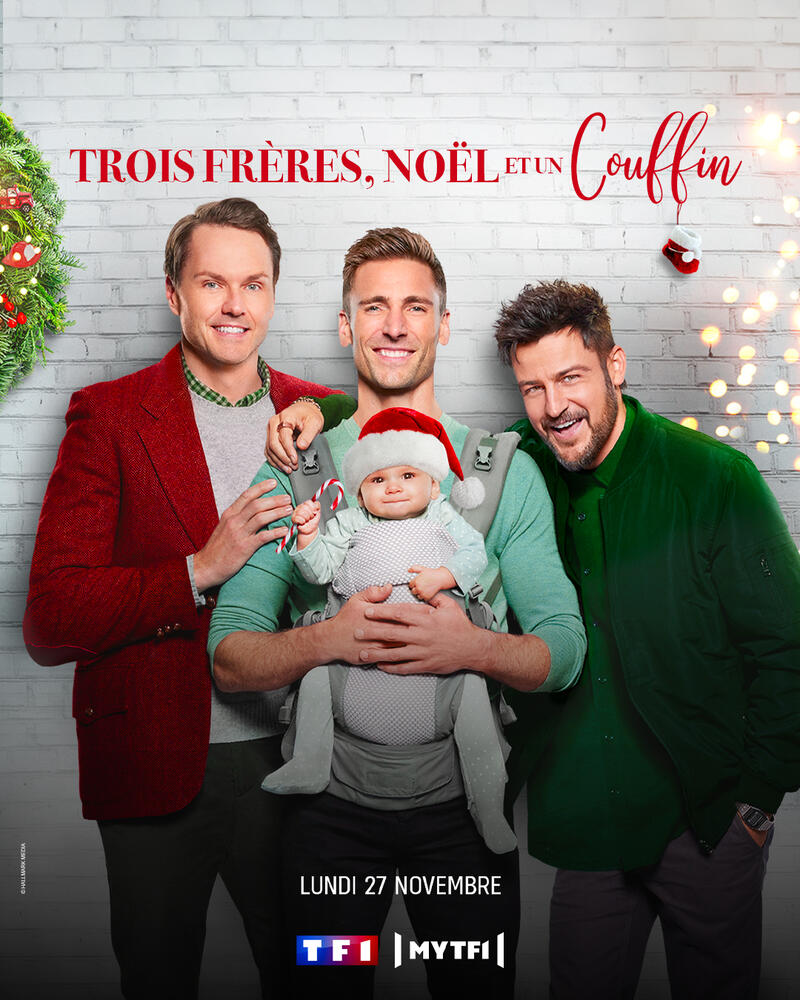 affiche du film représentant trois hommes et un bébé.